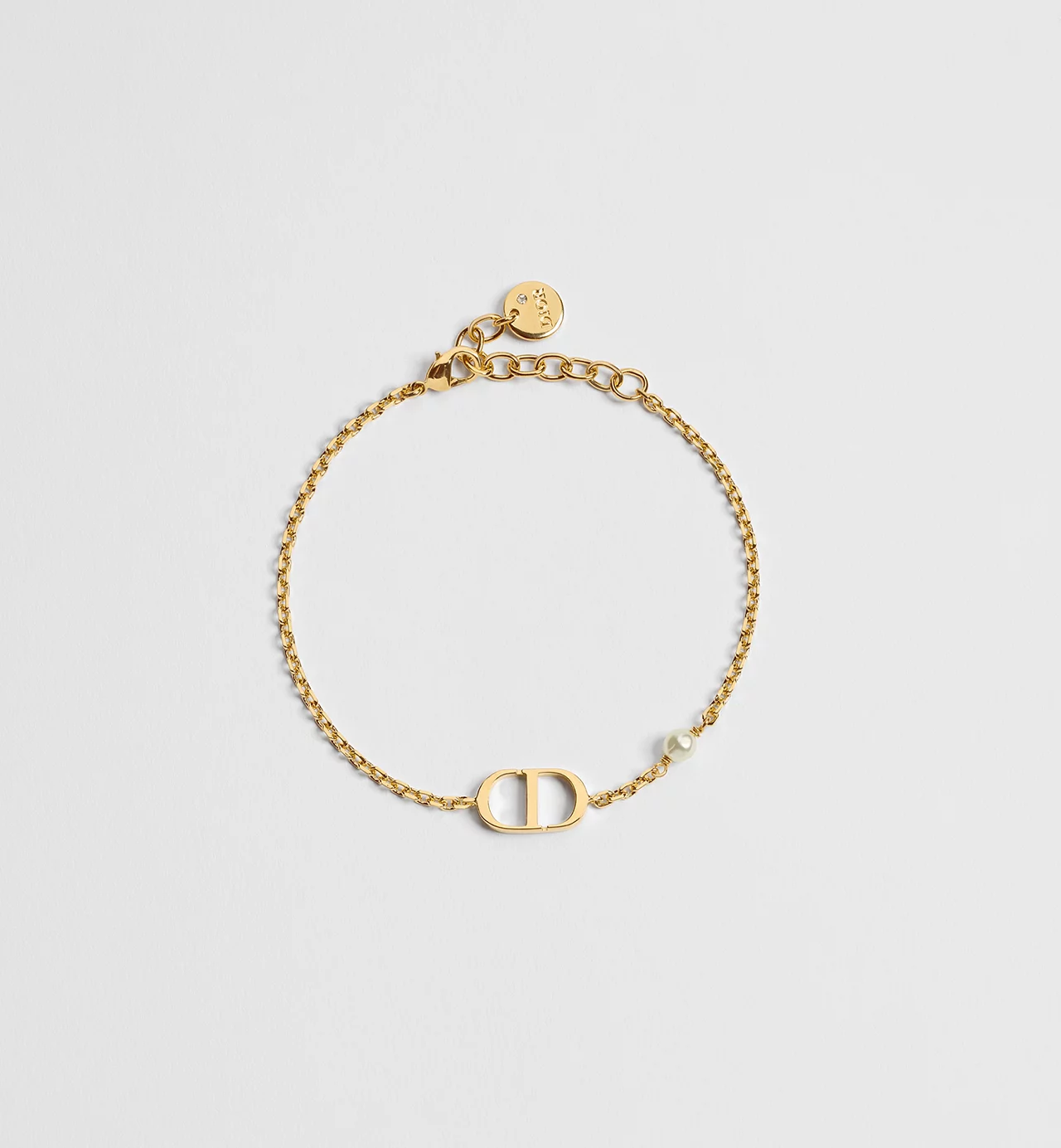 B1310PTCRSD301_SBG_E01-2 DIOR Petit CD Bracelet Gold-Finish Metal And White Resin Pearl Women - Image 1